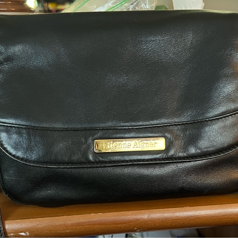 Vintage black leather Etienne Aigner crossbody purse with a gold-tone Buckle